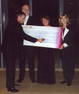 Adrian Boorman presents check to John Lubbock and Christine Cairns, Founders of Music for Autism, with actress Susan Hampshire.
